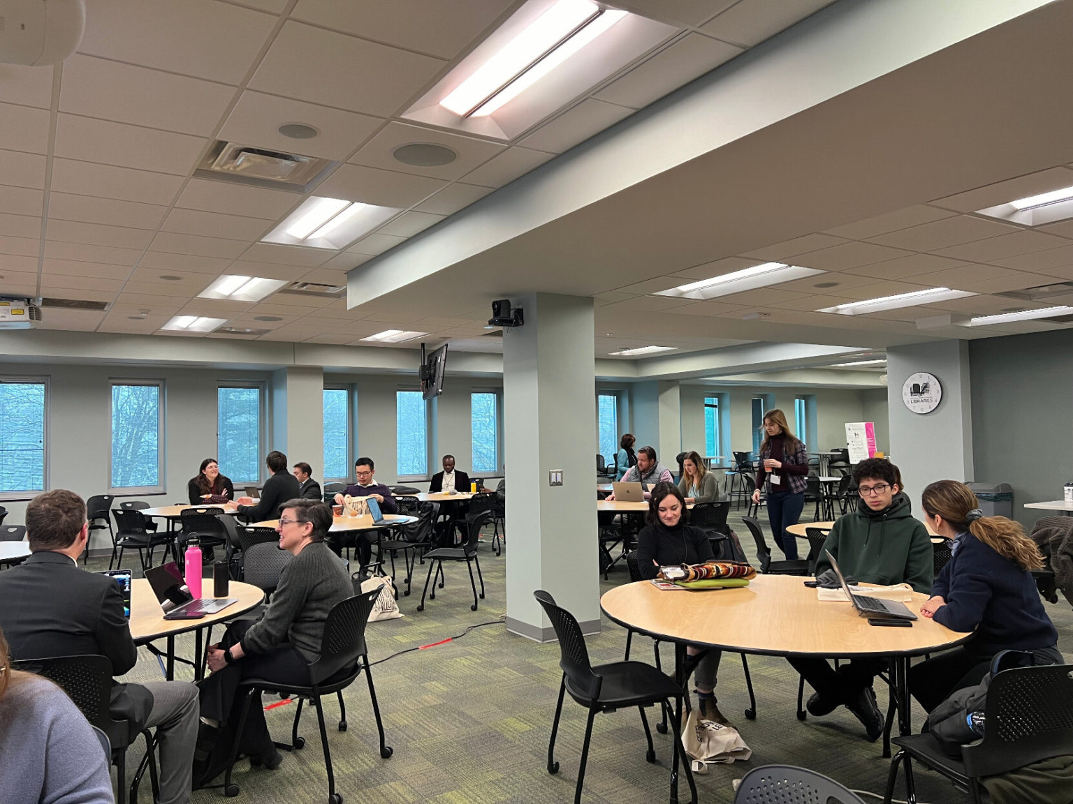 Attendees gather in the Green Room for a full day of presentations on March 22nd